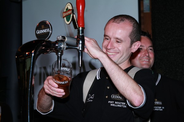 Finnbar Clabby from the D4 pours a pint while team mate Dermot Murphy looks on